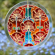 Painted Art Nouveau styled red & pink poppies against a background of orange, gold & turquoise on a stained glass suncatcher