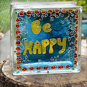 Glass block night light & suncatcher hand painted in sky blue with tiny red flowers & the words Be Happy in sunshine yellow