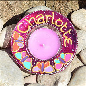 A pink tealight holder by Ornately Lanterns personalized for Charlotte, hand painted with colourful pink & purple butterflies