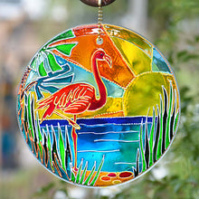 A fabulous Florida flamingo enjoys the gold sunshine, green reeds & blue waters on this hand painted stained glass suncatcher