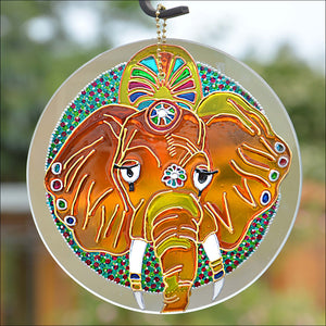 This hanging suncatcher features a gold elephant on a background of glowing jewel toned stained glass colours: the god Ganesh