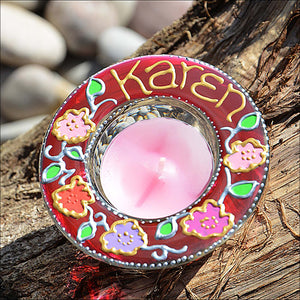 A colourful stained glass tealight holder personalised in pink with the name Karen and a ring of pretty country roses